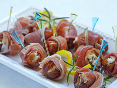Prosciutto Wrapped, Gorgonzola Stuffed Dates In A Honey-Balsamic Drizzle